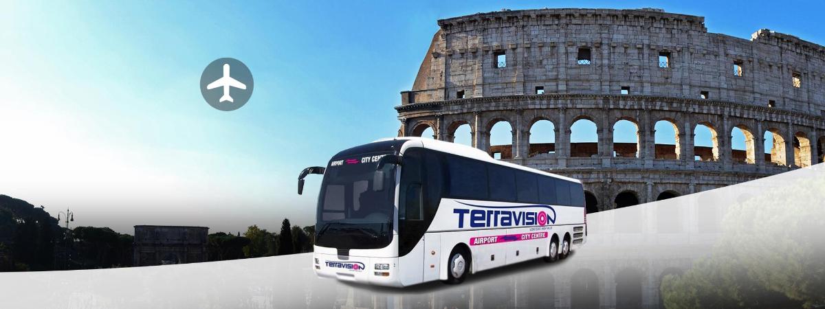 a white bus driving past the coliseum