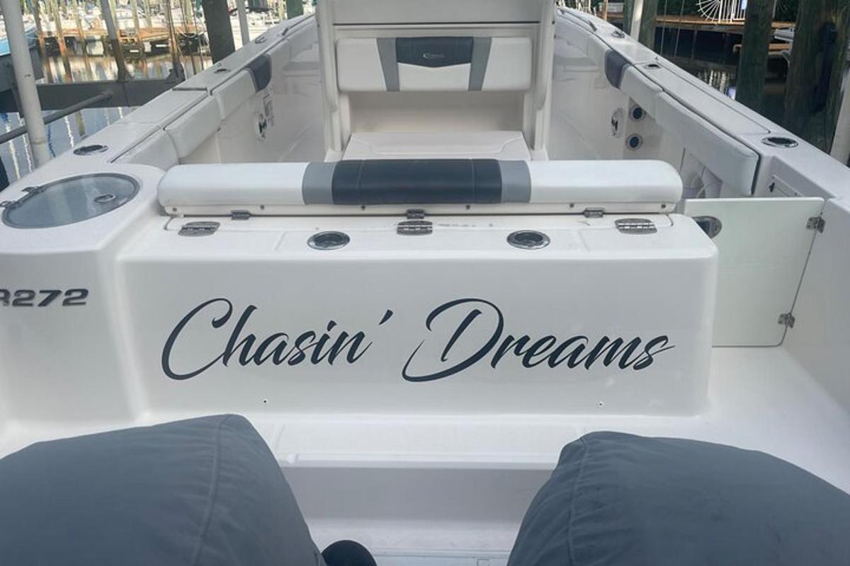 a white boat with the words cream dreams written on it
