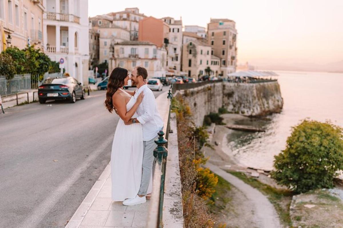 a bride and groom standing on a sidewalk near the water