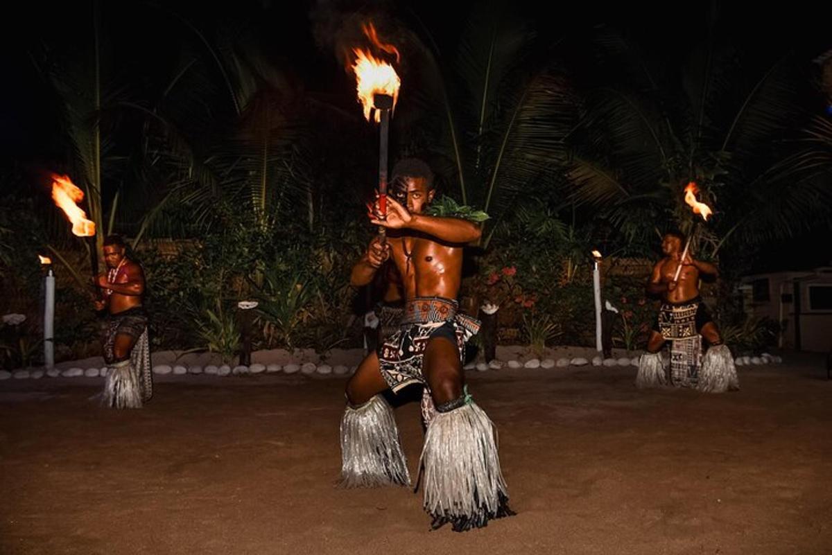 a man is holding a torch with fire