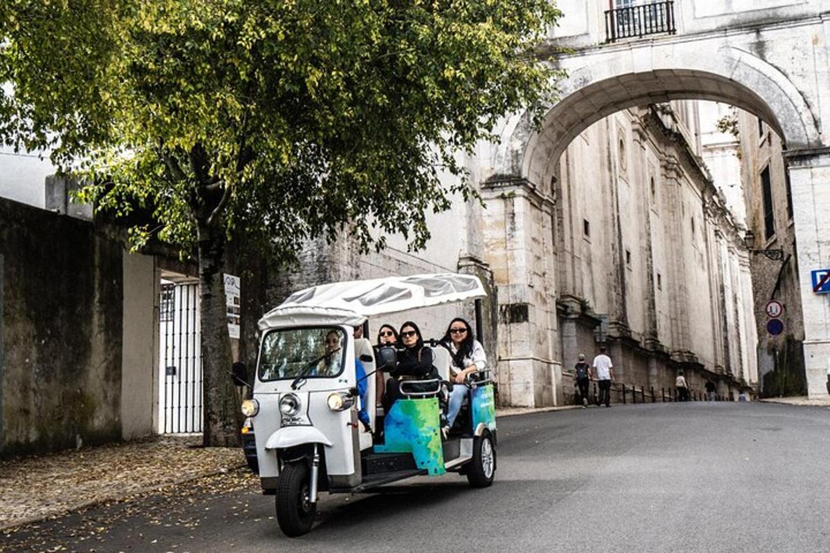 a group of people riding in a small car
