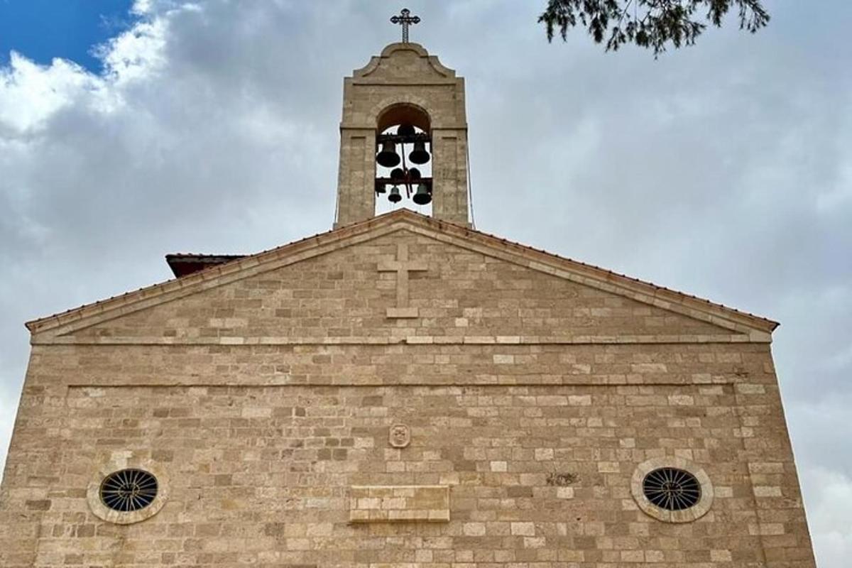 a church with a cross on the top of it