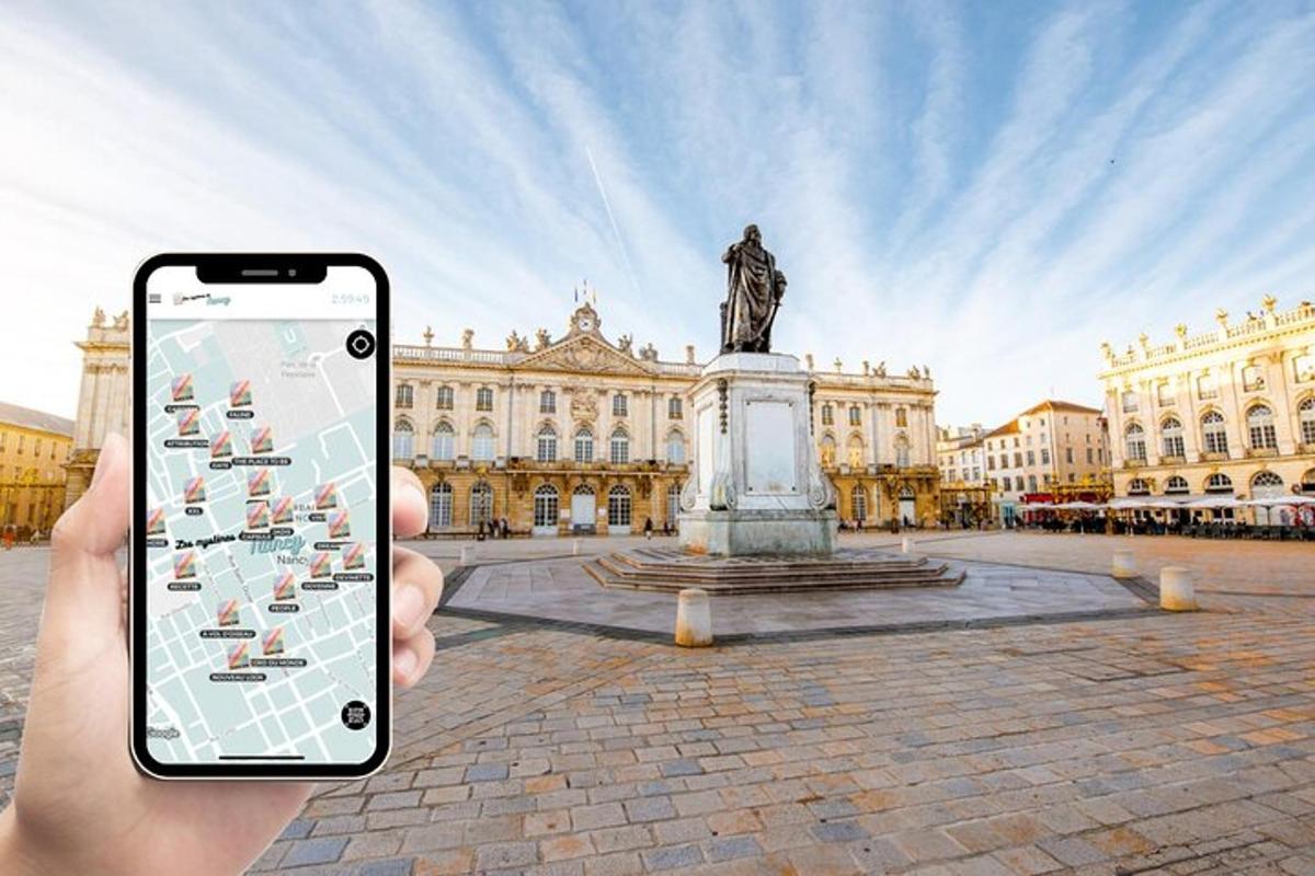 a person holding up a cell phone in front of a statue