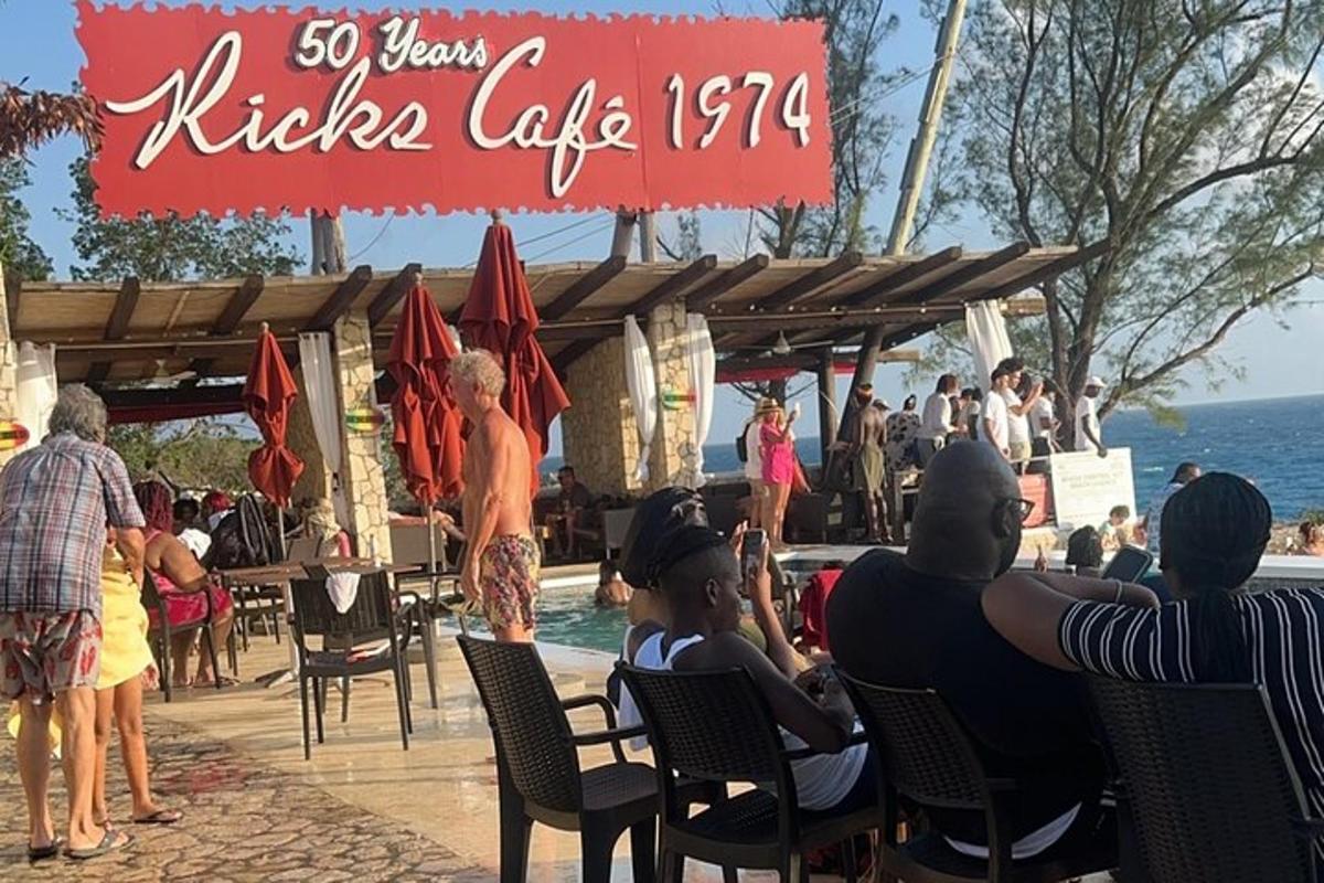 a group of people sitting in chairs at a restaurant