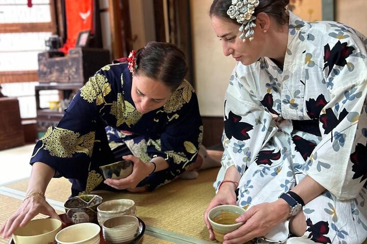 two women are preparing bowls in a kitchen