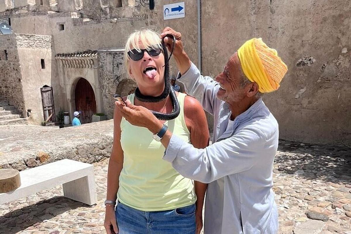 a man helping an older woman with her hair