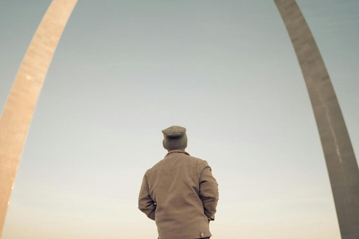 a man standing in front of a wall