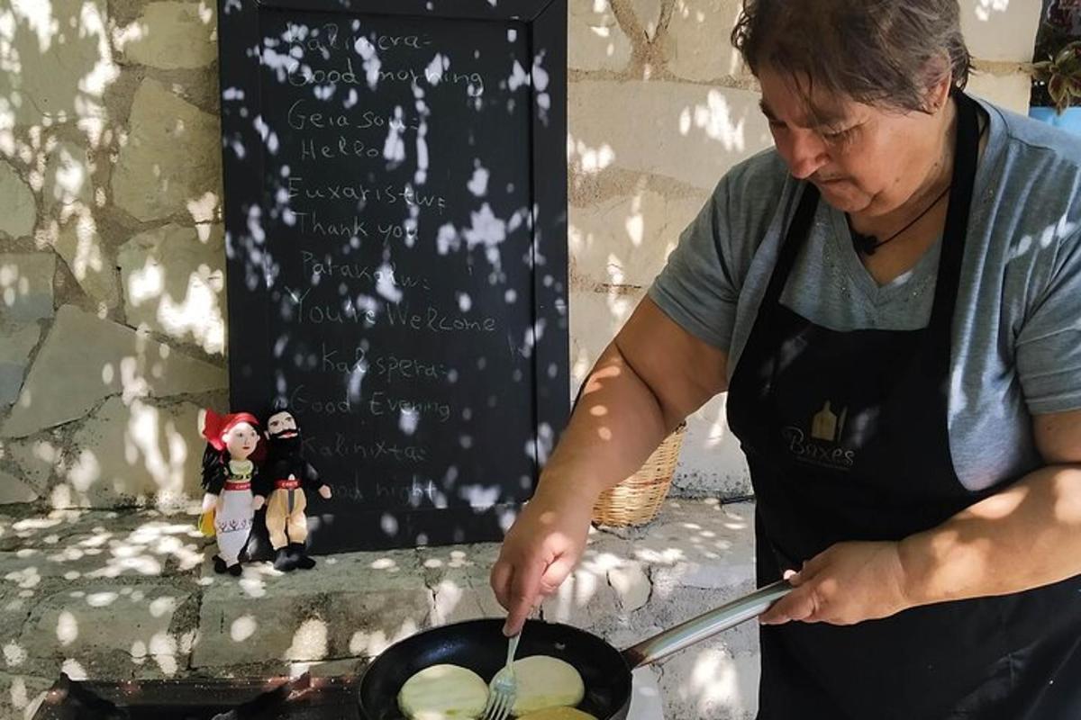a woman cooking food in a pan with a spatula