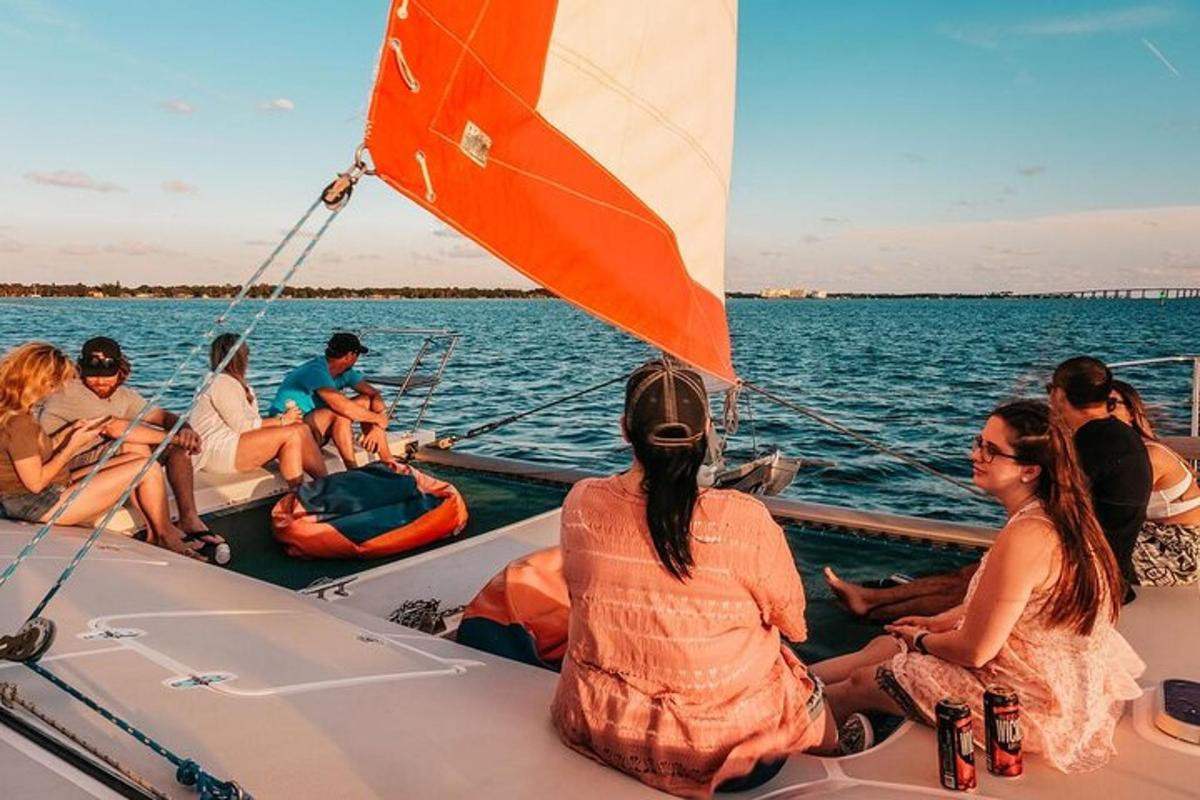 a group of people sitting on a boat in the water
