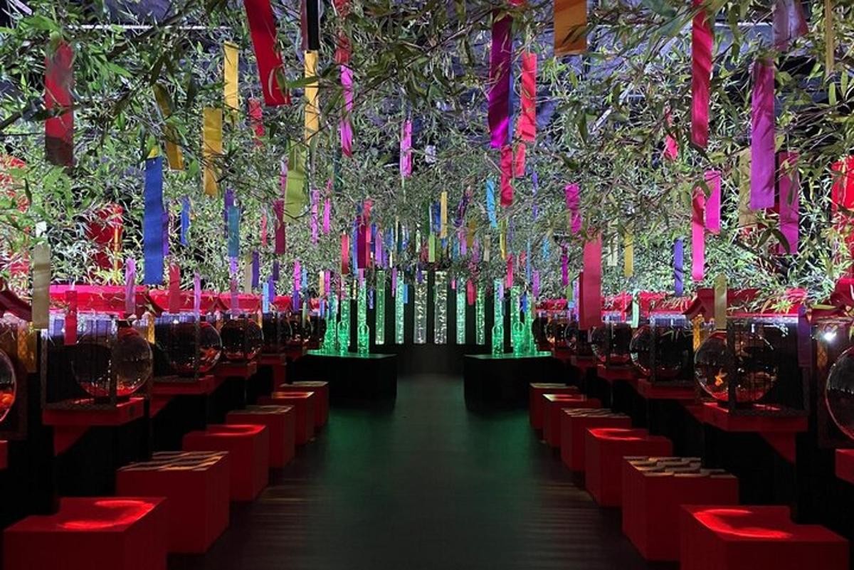 a long row of tables with wine glasses on them