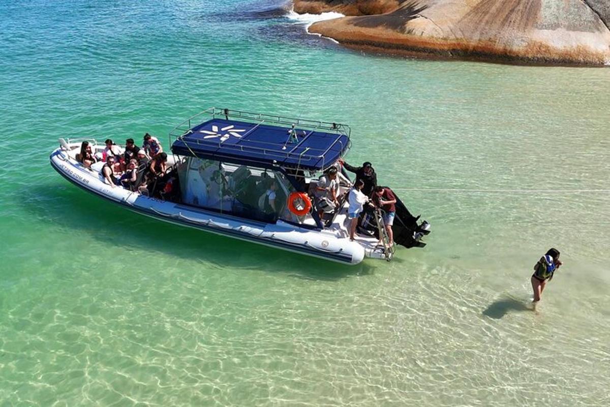 a group of people on a boat in the water