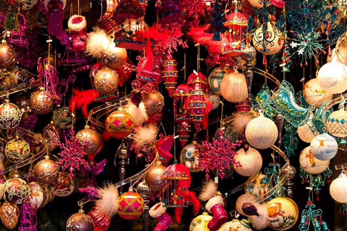 a bunch of christmas ornaments hanging on a wall