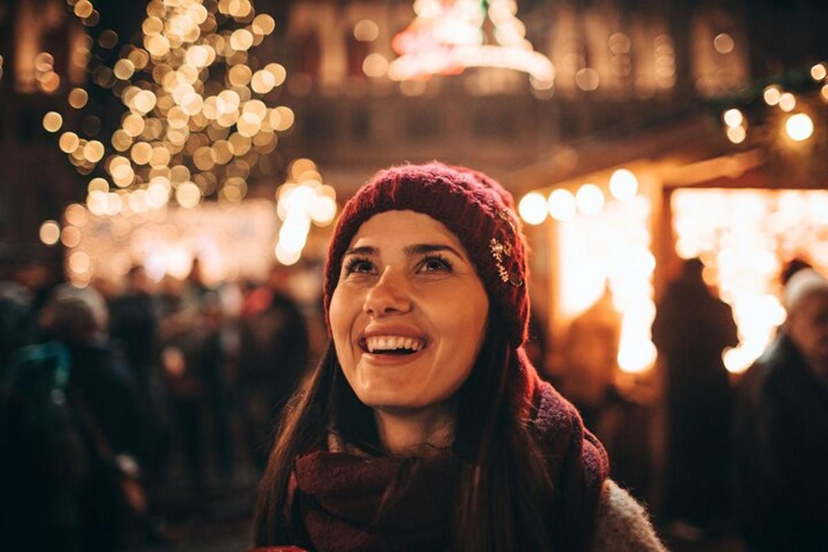 a woman standing in a street at night