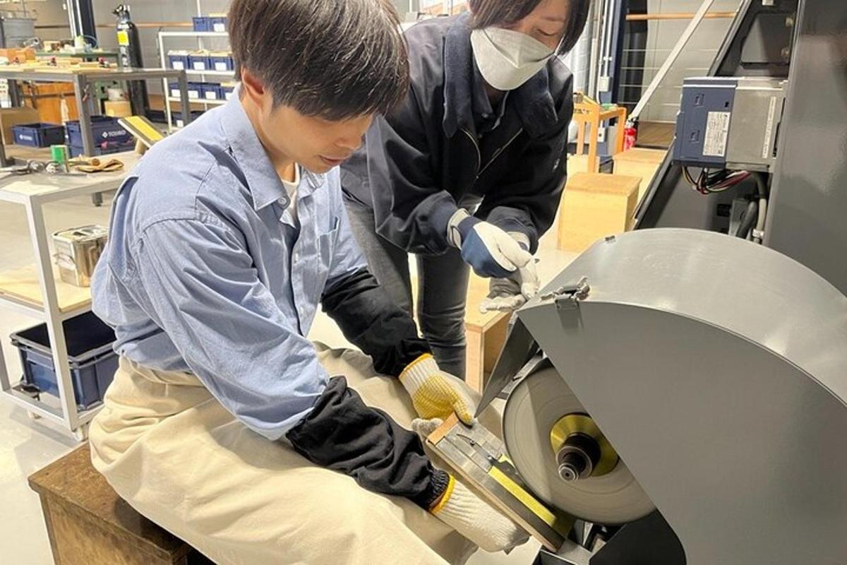 two people working on a toilet in a laboratory