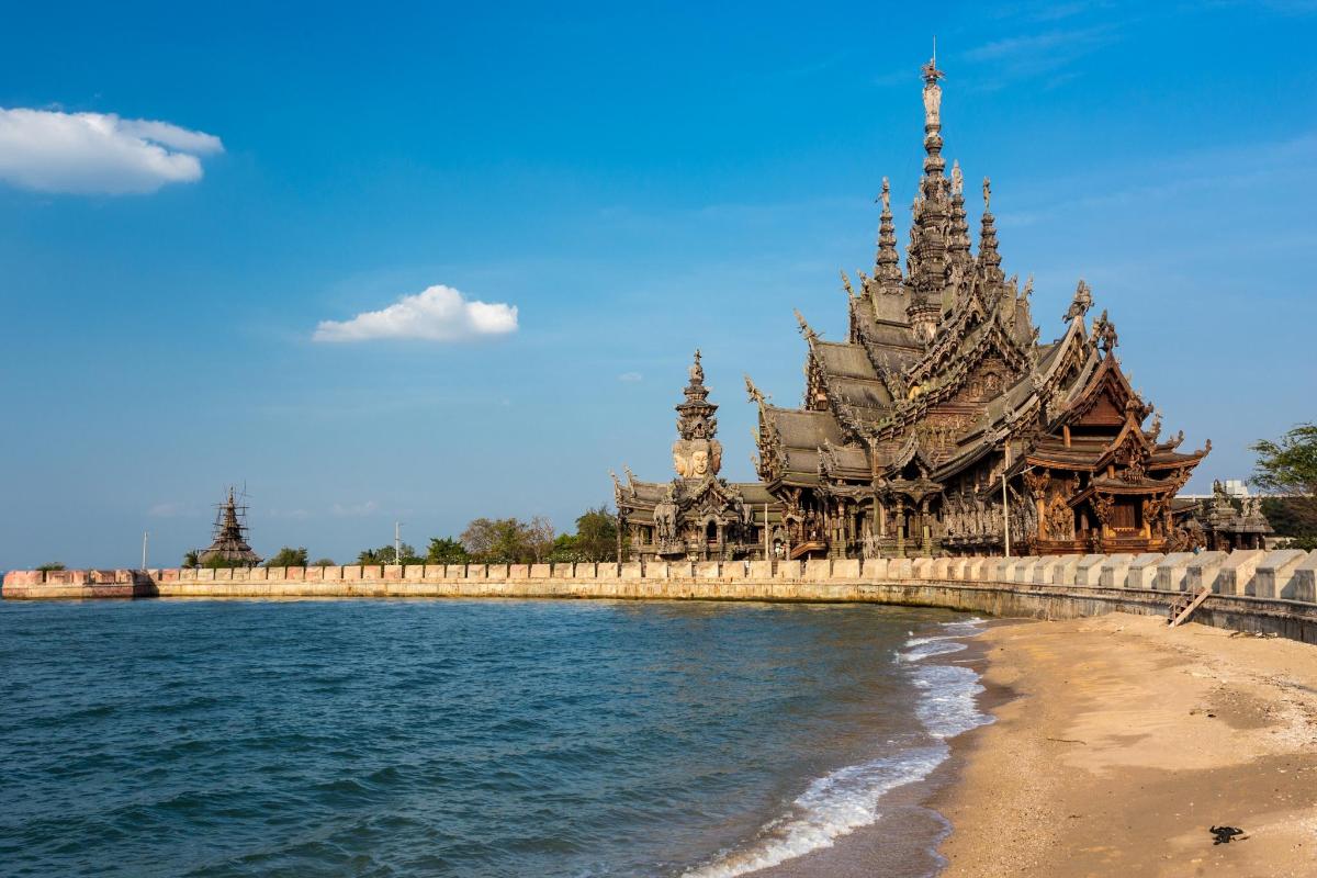 a building on the beach next to the water