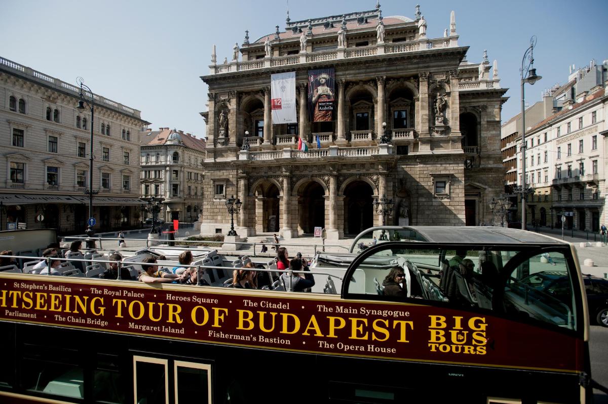 a double decker bus in front of a building