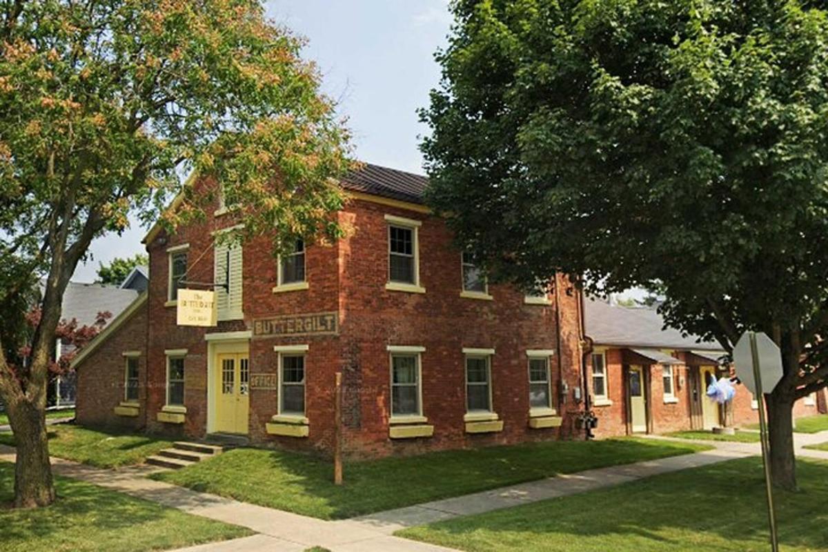 a red brick building with a sign on it