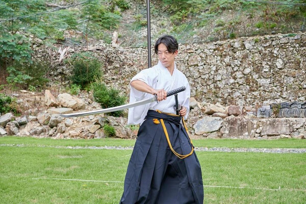 a man holding a baseball bat in a field