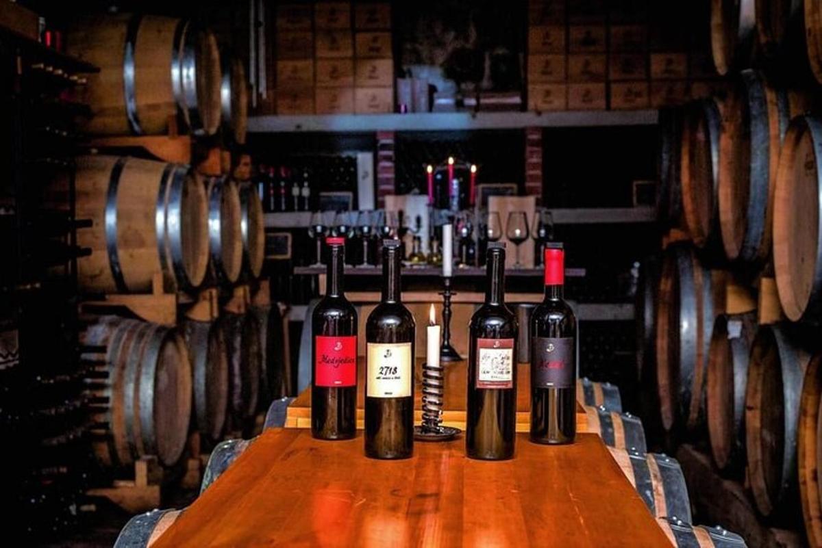 a group of wine bottles sitting on a wooden table