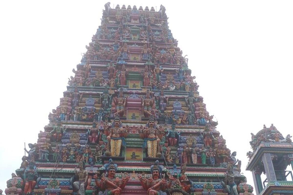 a tall building with many sculptures on it
