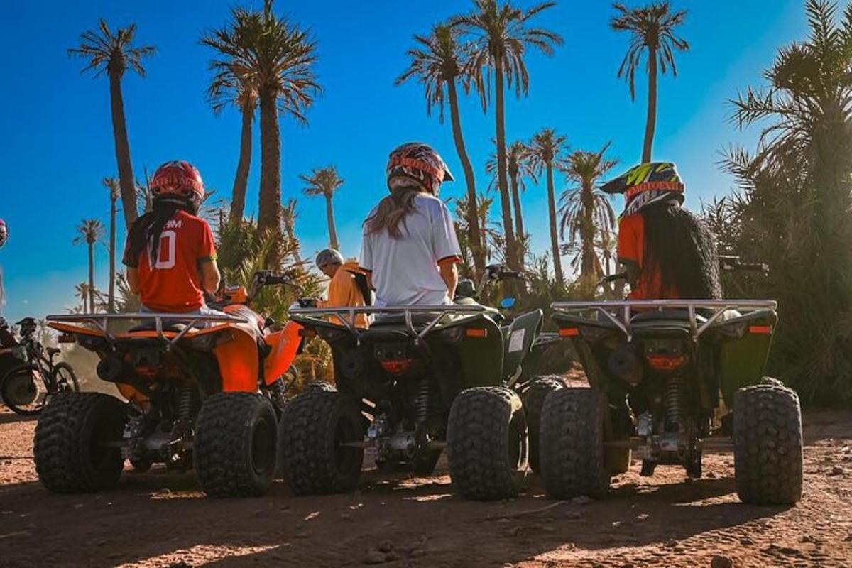 a group of people riding atvs on the beach