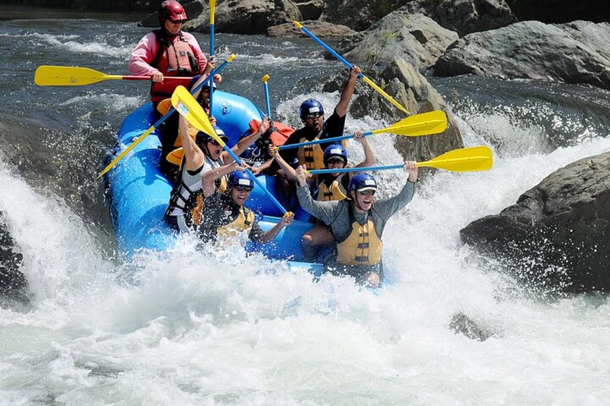 a group of people on a raft in a river