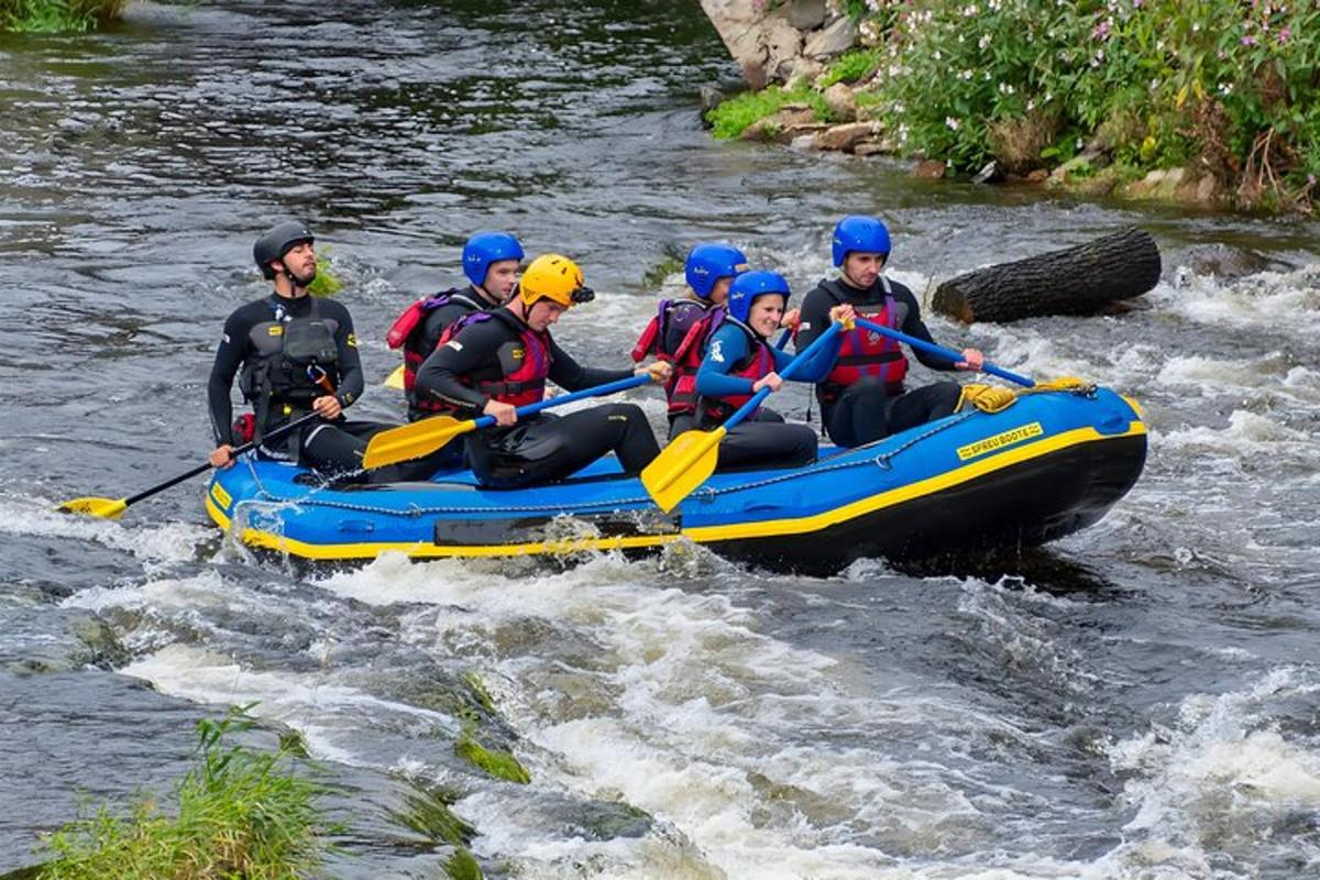 a group of people in a raft on a river