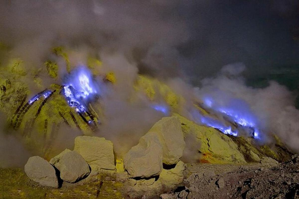 a train with blue lights on top of a mountain