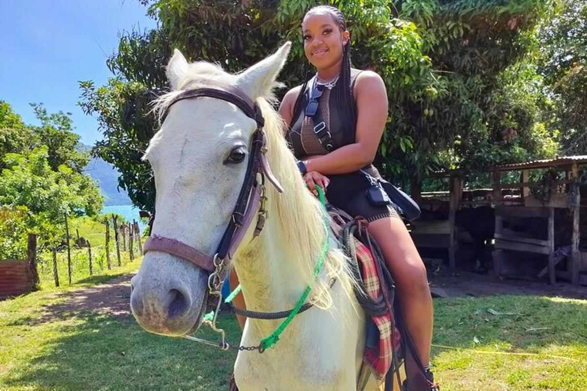 a young woman is sitting on a white horse