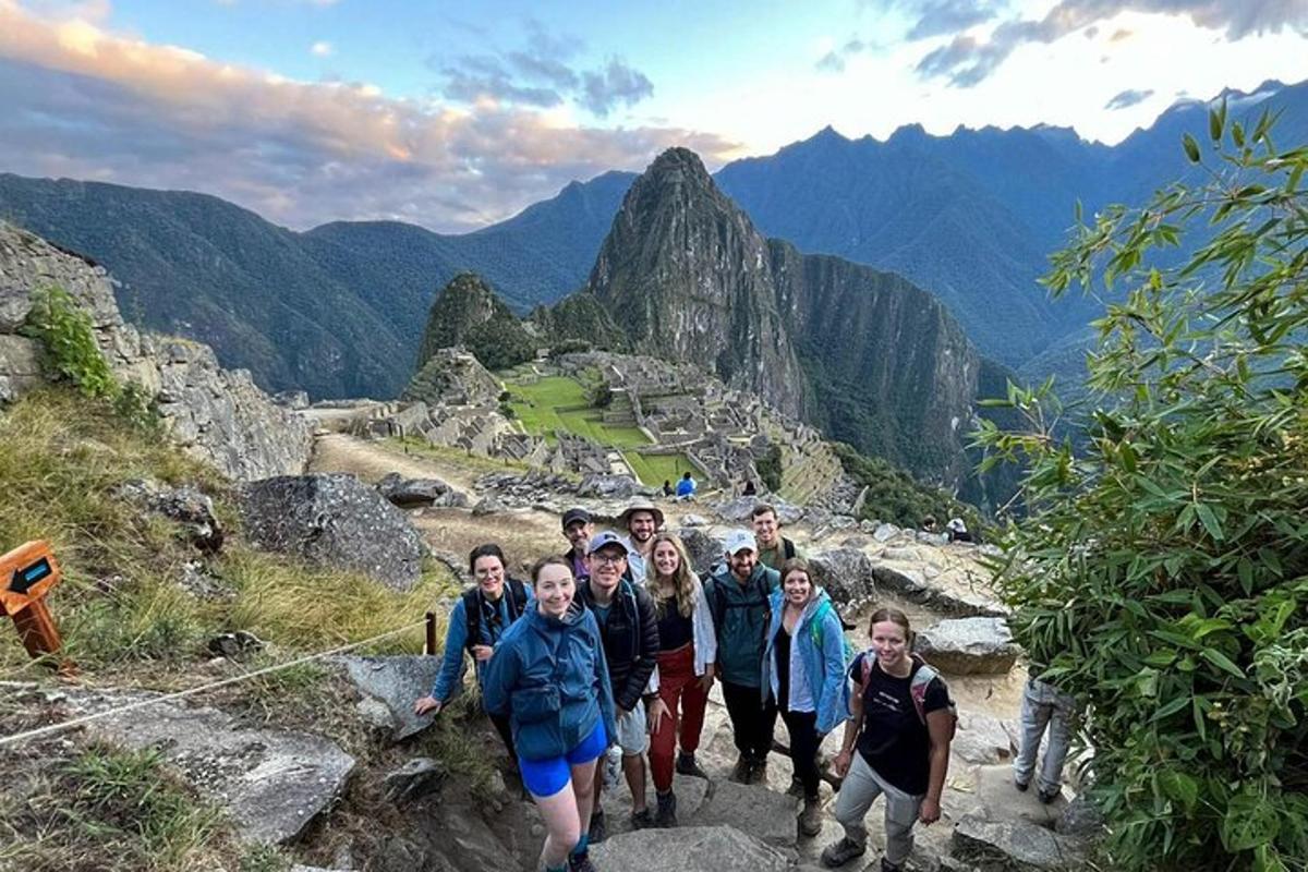 a group of people walking on a mountain trail