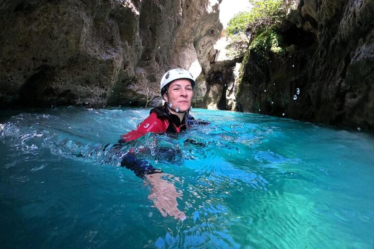 a man in the water in a cave