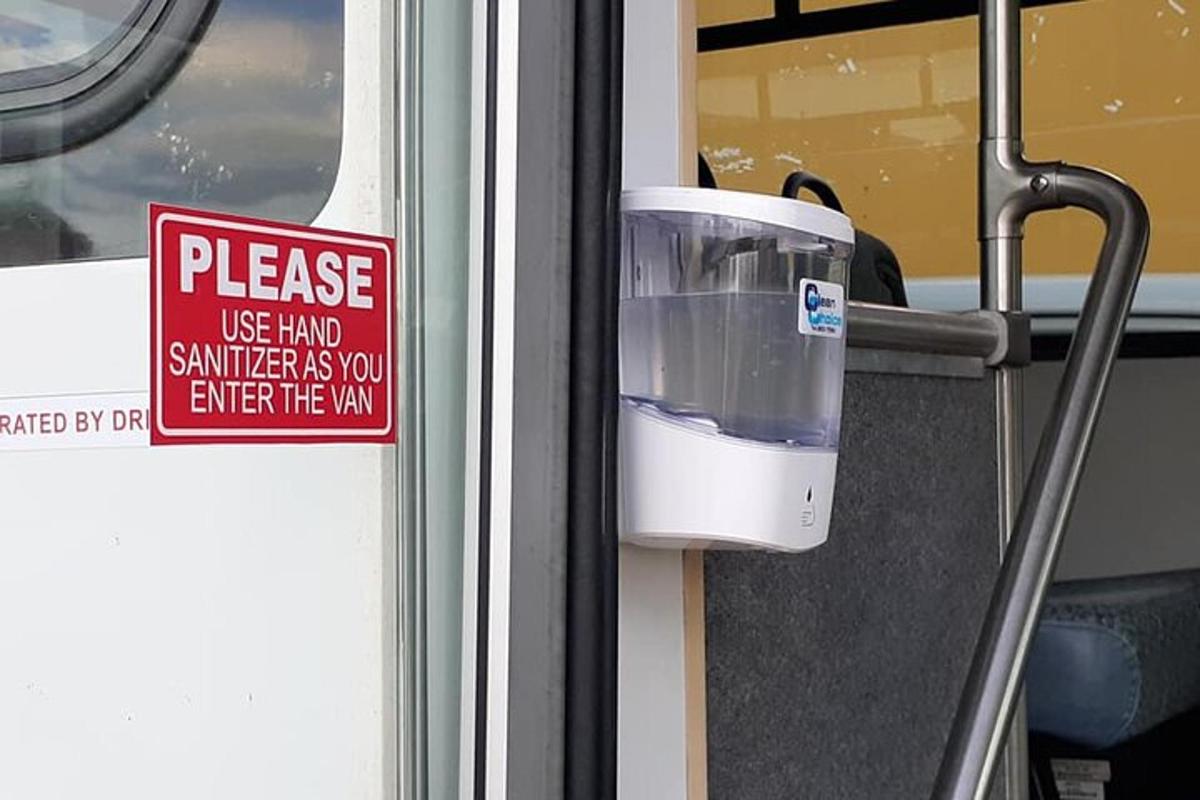 a sign that says please use hand member on a bus