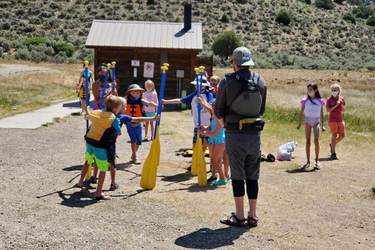 a group of children are standing around a group