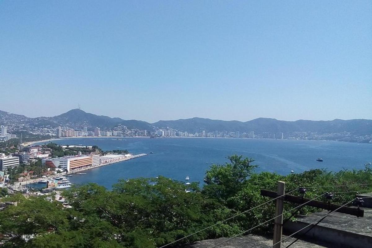 a view of a large body of water with a city