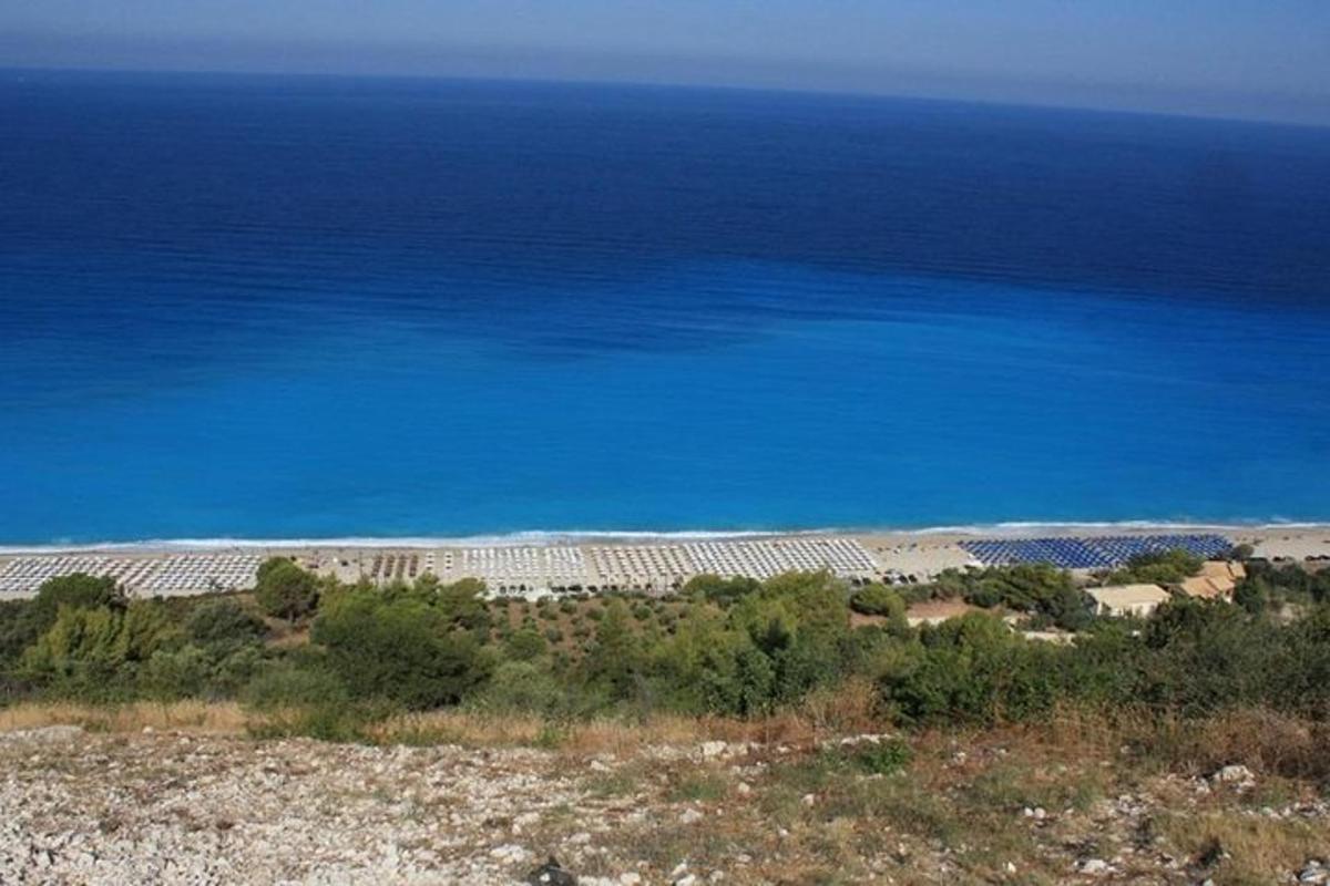 a view of the ocean from the top of a hill