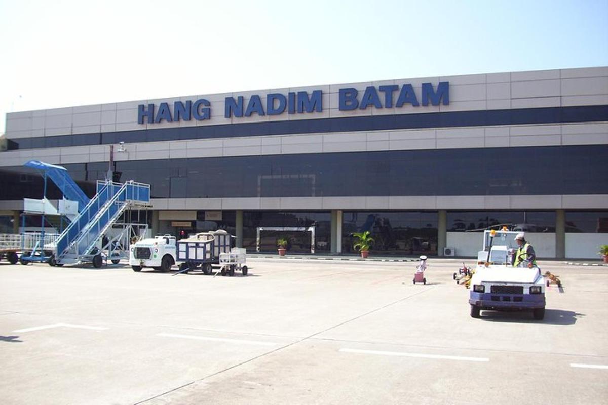 an airport with a hong malcolm benjamin sign on the building