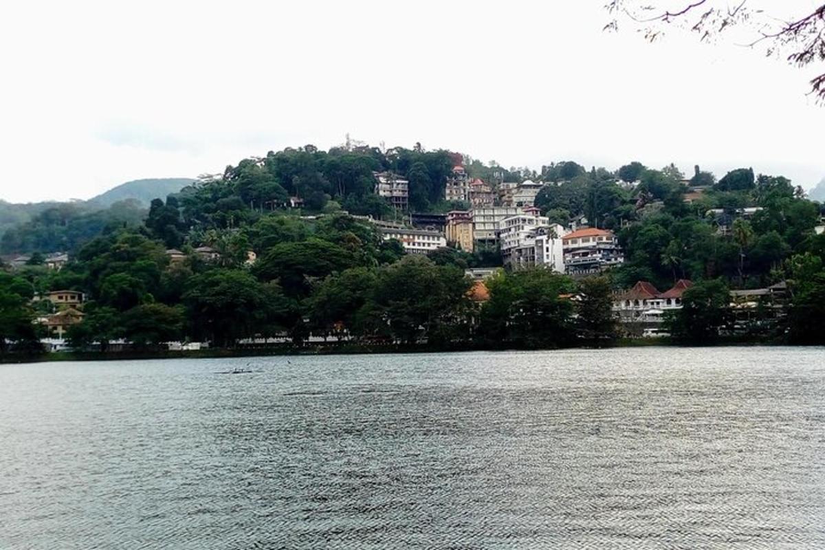 a large body of water with a town in the background