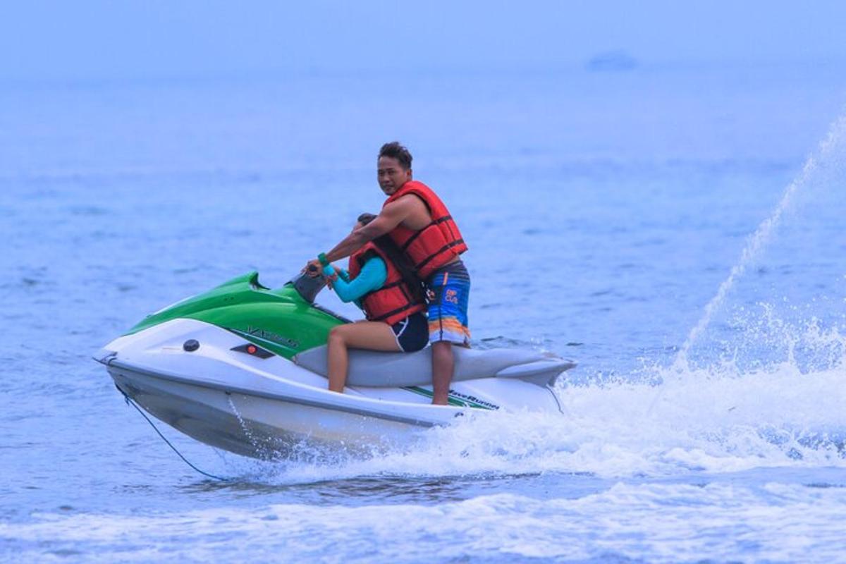 a man riding a jet ski in the water