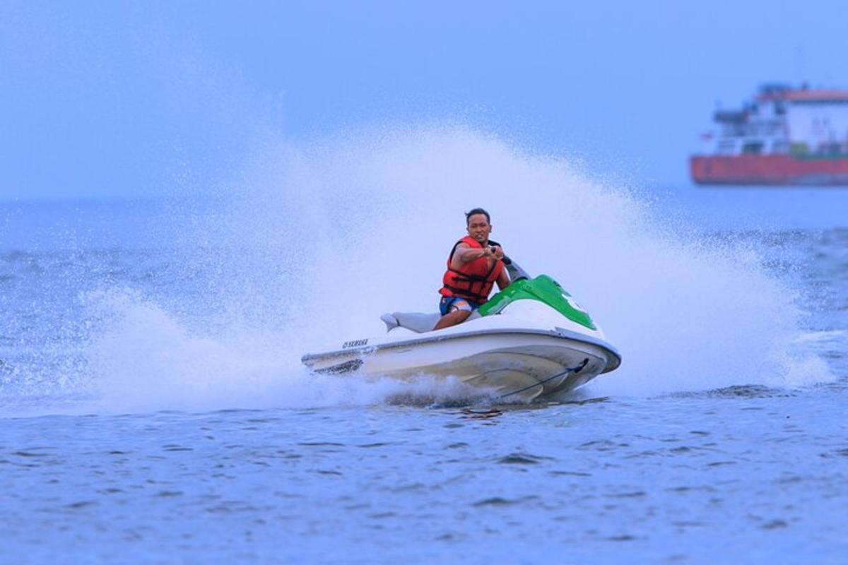 a man riding a jet ski in the water