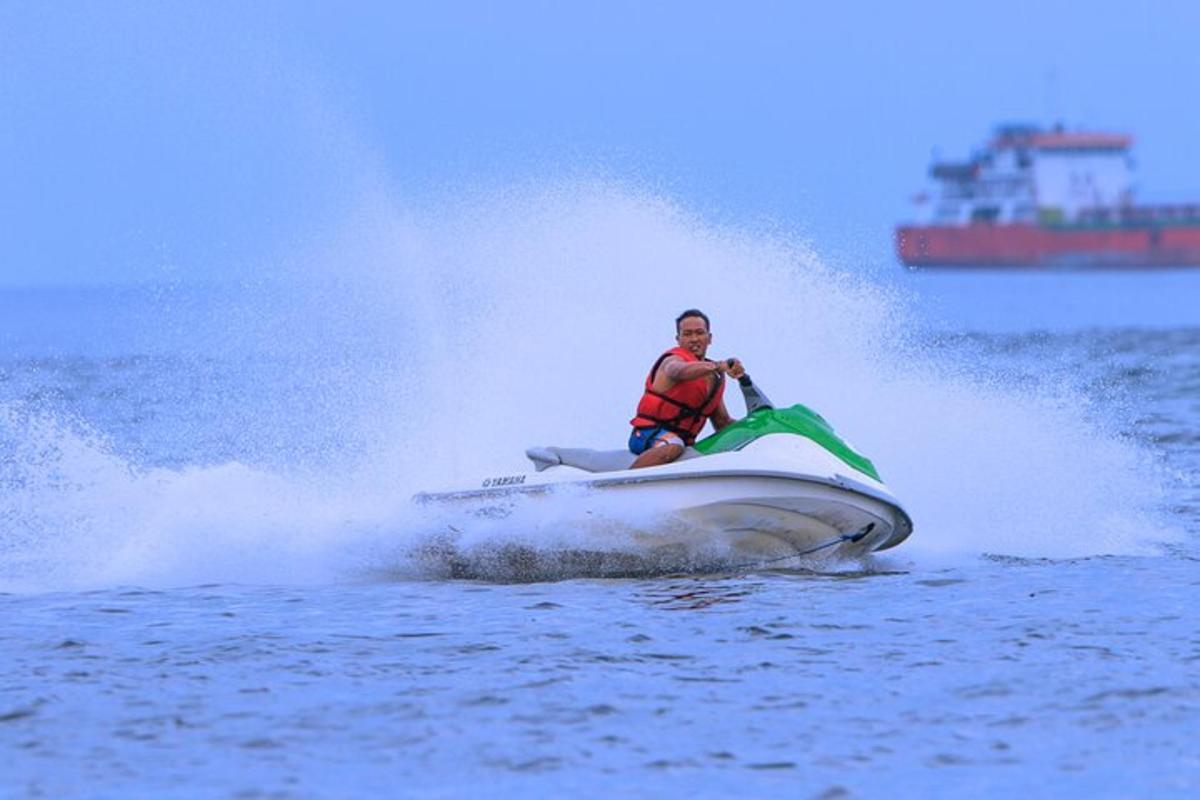 a man riding a jet ski in the water