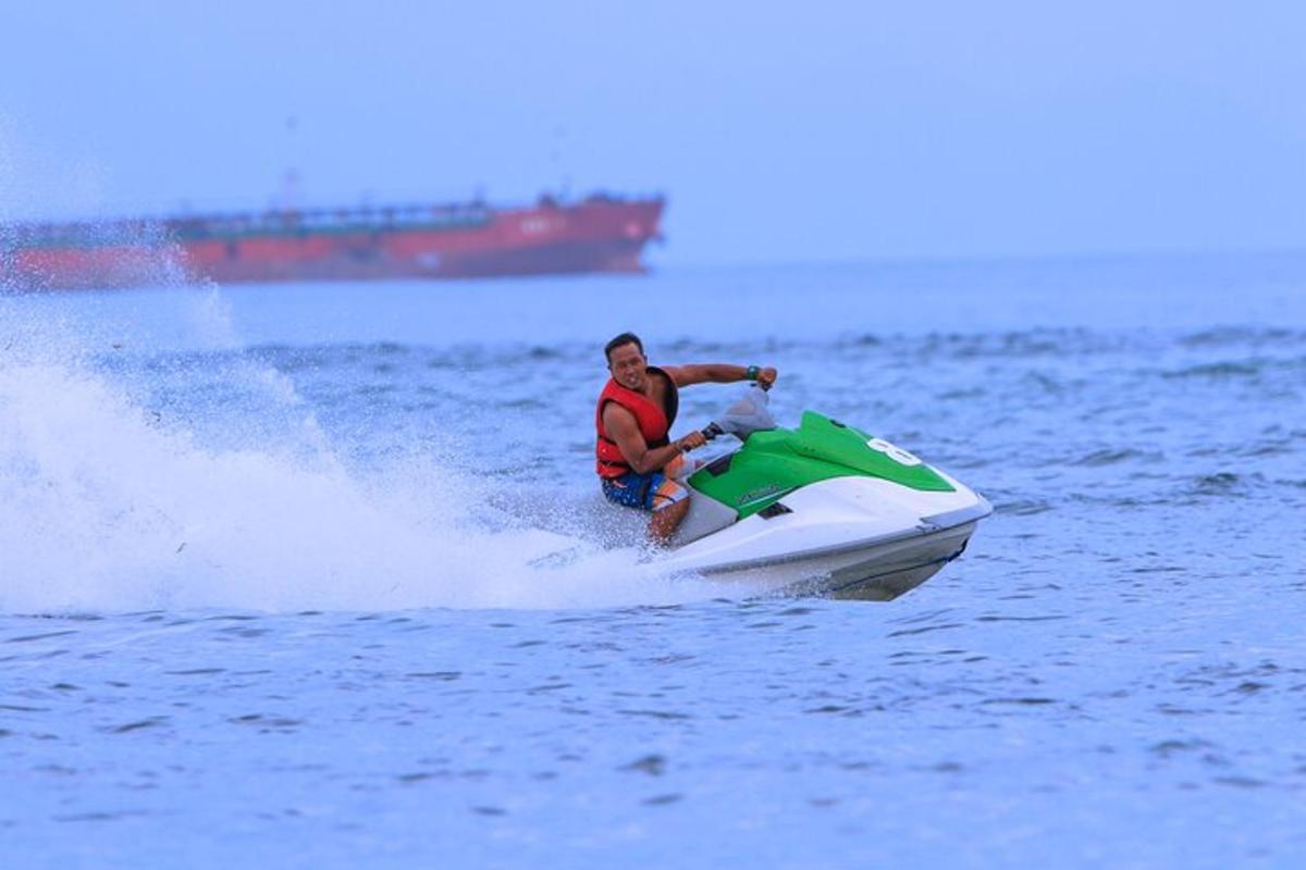 a man riding a jet ski in the water