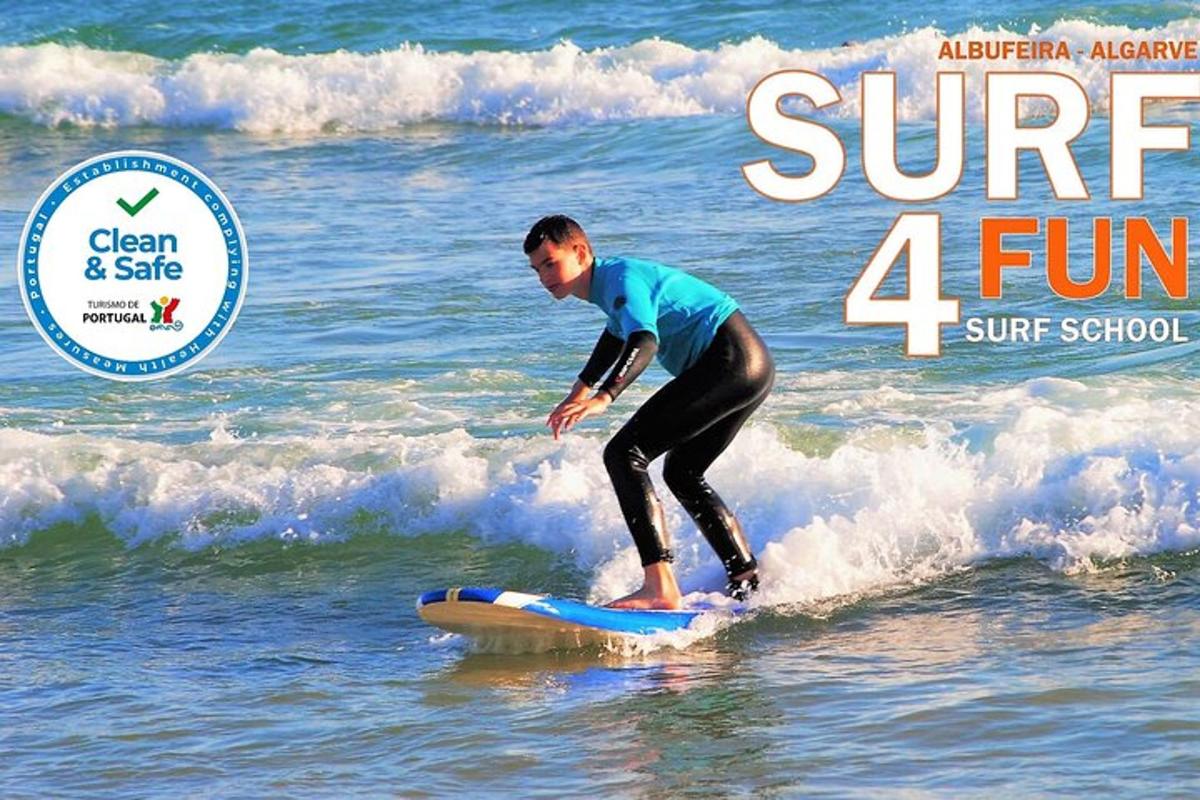 a young boy riding a wave on a surfboard in the ocean