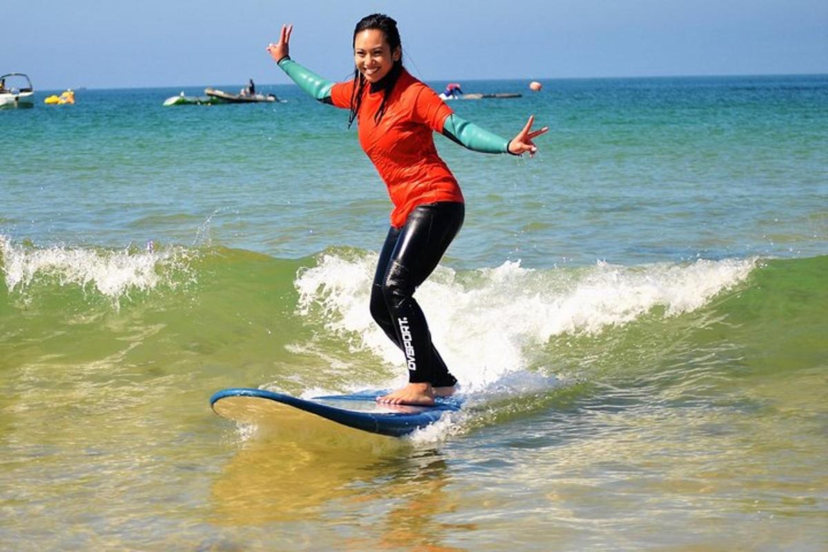 a woman riding a wave on a surfboard in the ocean