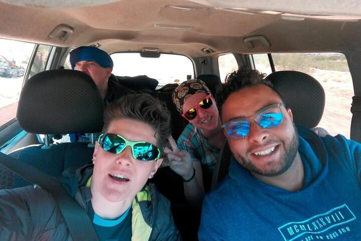 a group of people sitting in the back of a car