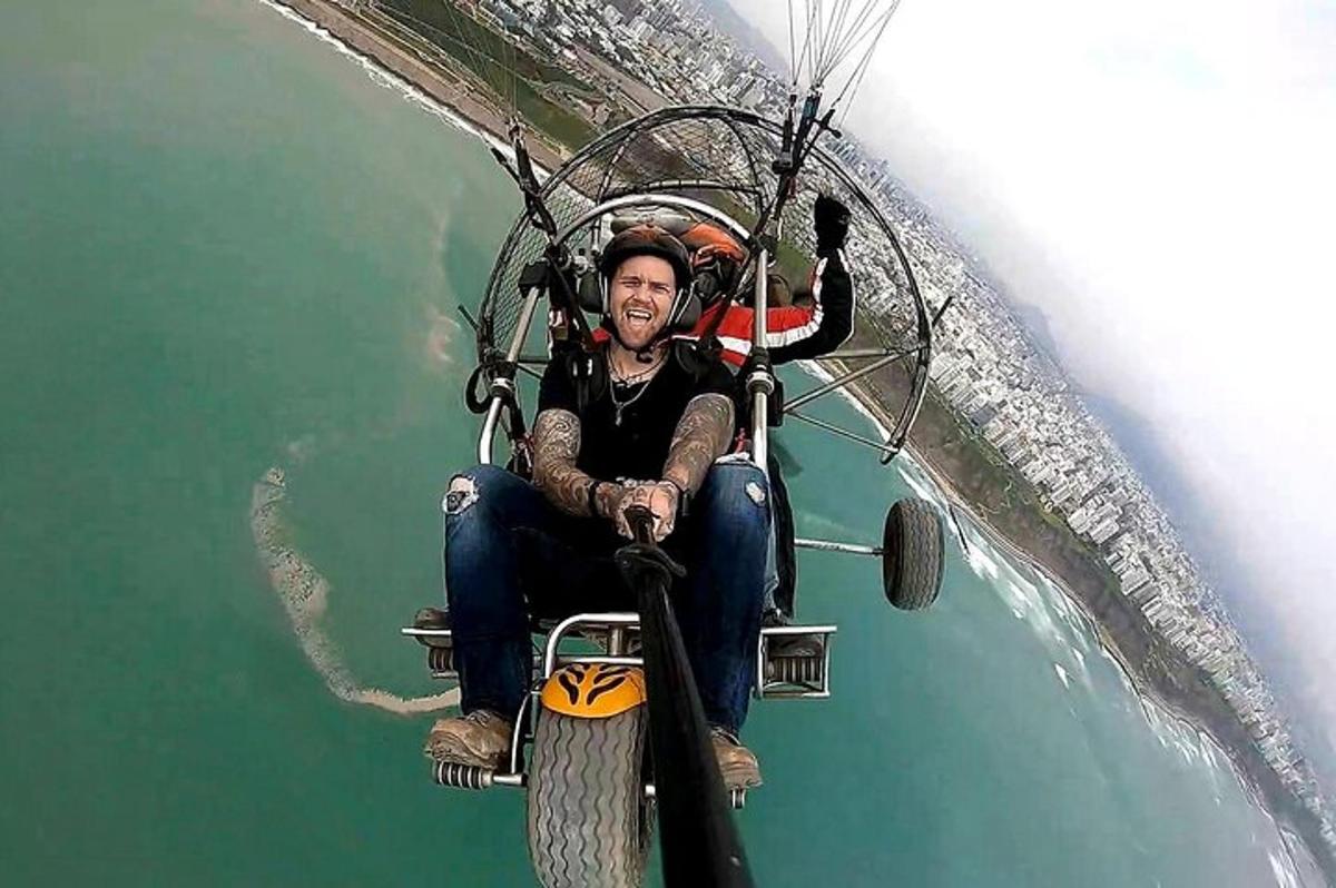 a man riding on a gondola over the water