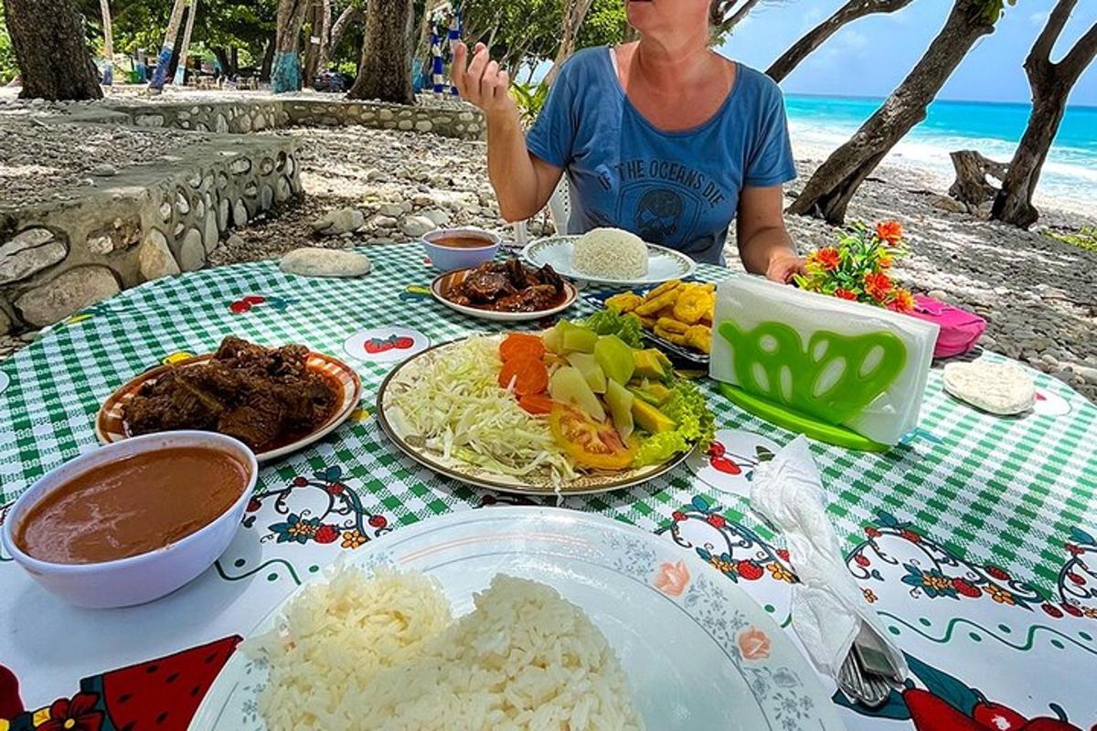 a woman sitting at a table with plates of food