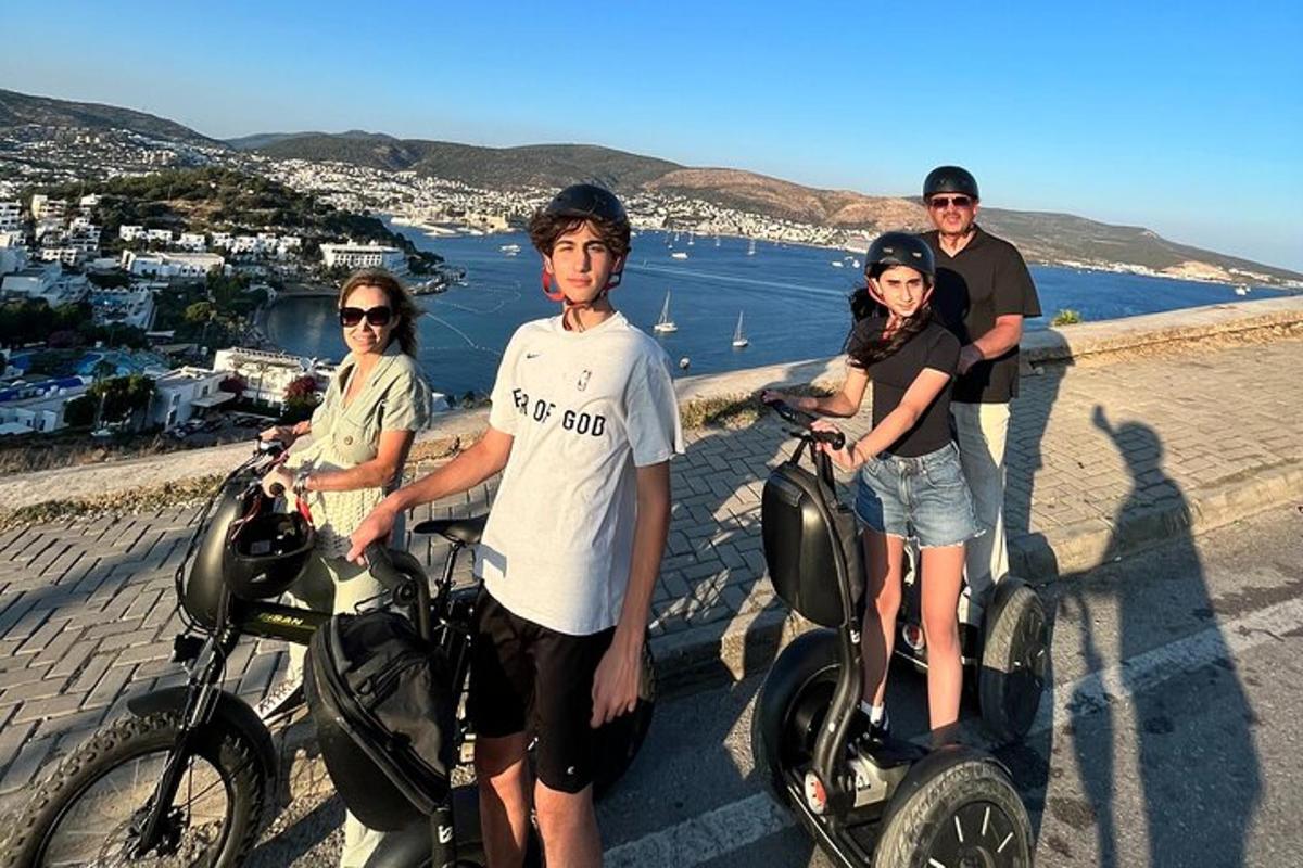 a group of people posing for a picture with their bikes