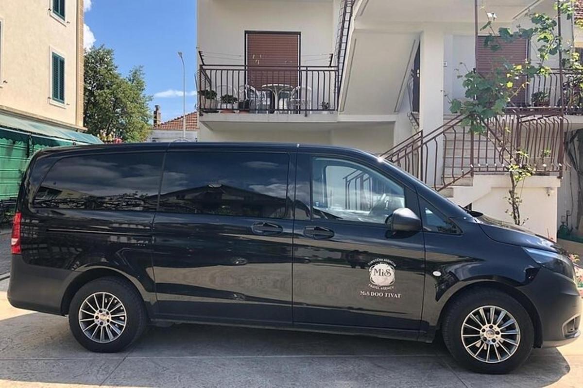 a black van parked in front of a building
