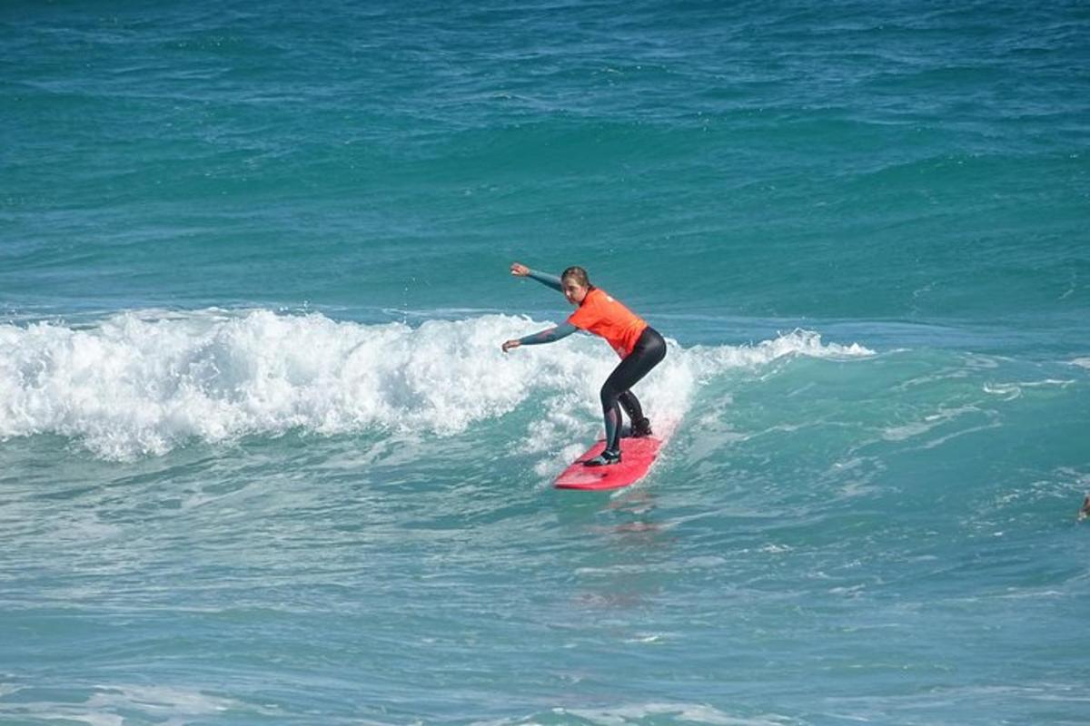 a person riding a wave on a surfboard in the ocean
