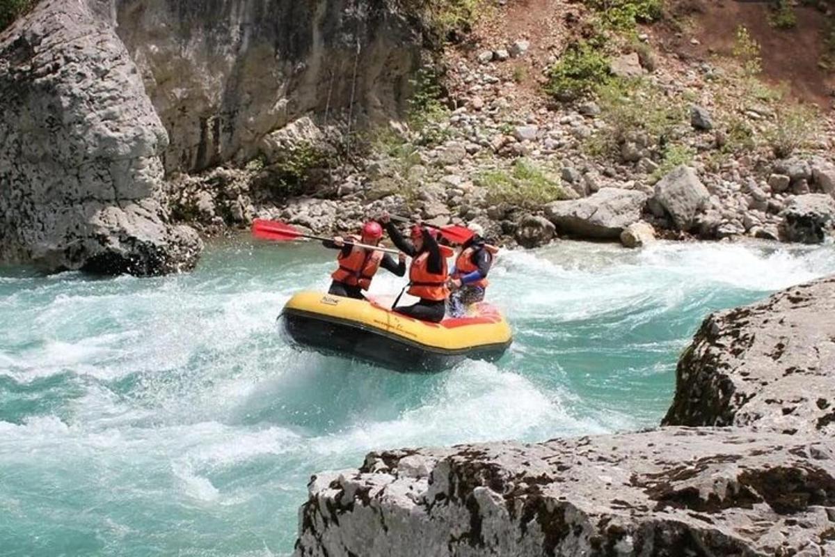 a group of people in a raft on a river